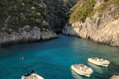 Porto Limnionas — Natural rock pools with crystal clear turquoise water and white limestone cliffs